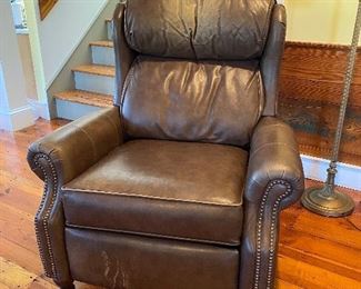 $350. (C4) Smith Brothers Tall leather press-back chair. Has marks on foot area and on the headrest. Measures 21" floor to seat x 36" wide x 44" floor to top of headrest.  