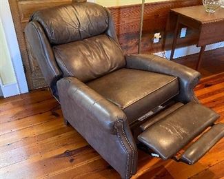 $350. (C4) Smith Brothers Tall leather press-back chair. Has marks on foot area and on the headrest. Measures 21" floor to seat x 36" wide x 44" floor to top of headrest.  