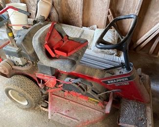 $100 Snapper mower with issues. Bad tires. Gear shift pin is out. No gas in it. 