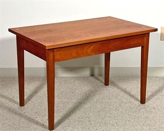 THOMAS MOSER LOW TABLE  | 
C. 1990, solid wood, with confirming glass top, signed by maker and dated on underside - l. 32 x w. 20 x h. 21 in.
