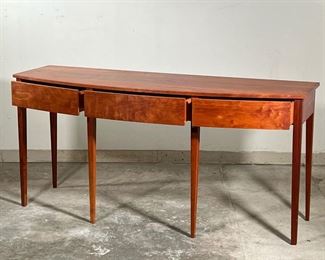 THOMAS MOSER SIDEBOARD  |  
Figured American cherry wood, having a bowed front with three drawers raised on six straight tapering legs - l. 72 x w. 24 x h. 34 in.

