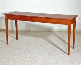 THOMAS MOSER SIDE TABLE  |
C. 1990, solid wood, with confirming glass top, signed by maker and dated on underside - l. 60 x w. 18 x h. 28 in.