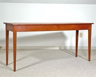 THOMAS MOSER SIDE TABLE  |
C. 1990, solid wood, with confirming glass top, signed by maker and dated on underside - l. 60 x w. 18 x h. 28 in.