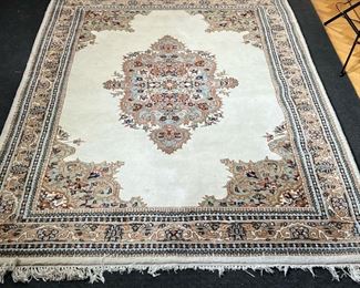 MEDALLION CARPET  |  
Hi pile with a central medallion on a cream ground, with scrolls in blue and teal green - l. 106 x w. 69 in.
