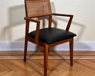 MID-CENTURY ARMCHAIR  |  
Mid century modern wood arm chair with a black leather cushion seat (removable) and a caned back - l. 20 x w. 18 x h. 32 in.