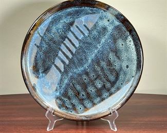 ART POTTERY PLATE  |  
Decorative glazed plate with abstract design, No apparent signature - dia. 11.5 in.