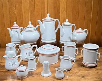 D'AUTEUIL TEA & COFFEE ITEMS  |
French Porcelaine D'Auteuil Bistrot Rust Orange coffee / tea service, including a coffee pot (h. 9 in.) and two smaller coffee pots, two different size teapots, two double-handled vessels with bottom strainers, a long strainer insert, six creamer / open pitchers of varying sizes, and a small lidded sugar pot
