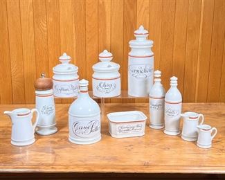 (11pc) D'AUTEUIL JARS ETC.  |
Porcelaine D'Auteuil Bistrot Rust Orange kitchen canisters etc., including a pepper mill, olive oil and vinegar bottles, 2 lidded jars, a tall leaded canister with a spoon holder, a handled jug, three different sized small open pitchers, and a rectangular box [missing lid] - h. 11 in. (tallest)