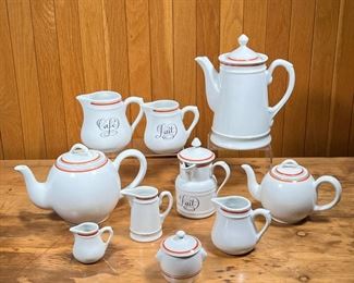 (10pc) D'AUTEUIL COFFEE & TEA SERVICE  |
French Porcelaine D'Auteuil Bistrot Rust Orange tea / coffee set, including a coffee pot (h. 9 in.), two teapots of different size, a covered "Lait" pitcher, an open "Lait" pitcher, an open "Cafe" pitcher, three different creamer / pitchers, and a covered sugar pot of small size