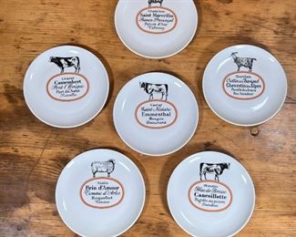 (6pc) D'AUTEUIL CHEESE PLATES  |
Porcelaine D'Auteuil regional cheese plates showing different cows and sheep and describing different types of cheese - dia. 7 1/2 in.