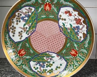 MONUMENTAL JAPANESE CHARGER  |
Heavy! Large charger dish having a Japanese design with green, red, and gold details, with blue underglaze marks on bottom - h. 2 3/4 x dia. 18 in.