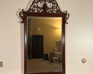 OPENWORK WOOD MIRROR  |
Carved openwork wall mirror with a shaped swans neck pediment, with a beveled glass mirror surface - w. 30 x h. 52 in.