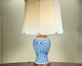 BLUE & WHITE BALUSTER LAMP  |
Porcelain table lamp with scroll and vine decoration, on a wooden base - h. 24 x dia. 16 in. (over shade)