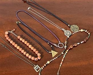 SILVER & OTHER JEWELRY  |
Including a sterling silver chain, a wood beaded necklace, a multi beaded necklace, and others