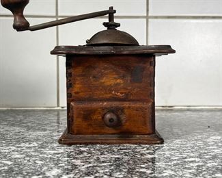 EARLY COFFEE GRINDER  |
Wood case with metal hardware, no apparent identifying marks - l. 5.75 x w. 5.75 x h. 6.75 in.