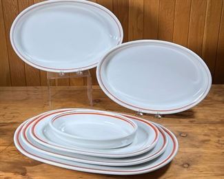 (6pc) D'AUTEUIL PLATTERS  |
French Porcelaine D'Auteuil Bistro Rust Orange serving dishes / bakeware, including three nesting platters (largest 16.5 x 10-3/4 in.), two 13.5-inch baking dishes and a small 9-inch oval baking dish