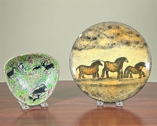 (2pc) ANIMAL POTTERY PLATES  |
One glazed plate showing what appears to be horses on a field, and the other a green dish showing a variety of animals - dia. 9 3/4 in. (largest)