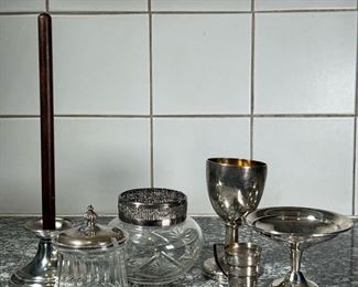 (7pc) SILVER & OTHER ITEMS  |
Including a Reed & Barton sterling compote (h. 3 3/4 in.), a glass jar with a sterling lid, a Christofle citrus squeezer, and other silver plate and stainless items