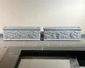 (2pc) PAIR CONCRETE PLANTERS  |
Two large concrete planters with ornate designs - l. 39.5 x w. 13.5 x h. 13.5 in.