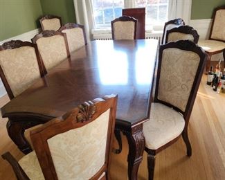dining table with 2 leaves and 10 chairs. (MAY BE PURCHASED BEFORE THE SALE).  $425.00.   75" x 45" Has two 18" leaves