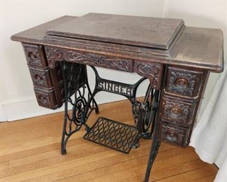 antique Singer sewing machine and cabinet