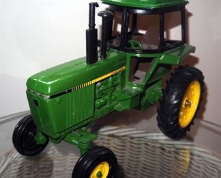 Ertl Diecast John Deere Model Tractor, 1/24 Scale 55' Chevy Pick Up Truck, And Old Navy Supply Chevy C3100 Diecast Model Truck