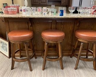 3 Leather studded swivel bar stools