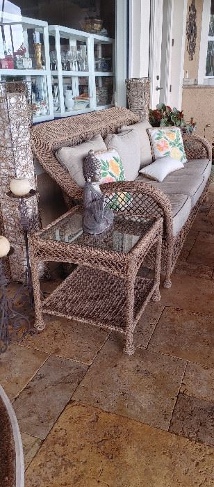 Beige wicker sofa and four end tables