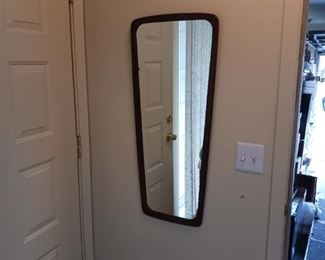 Funky mid-century wall mirror with a wood frame