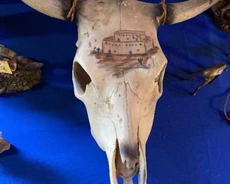 Not sure, but the painting looks like Taos Pueblo 