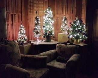 Small Christmas Trees in wooden boxes for easy storage and less decorating hassle. Arm Chairs, dressing folding screen.