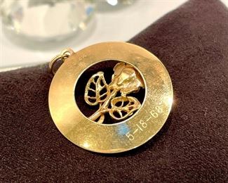 $220. Marked AC14K Gold, vintage commemorative date pendant marked "A Day to Remember." There is a date from the 60's lightly etched on back. This can be removed by your jeweler.  Approx 28MM diameter