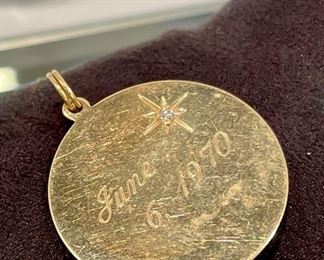 $220. Marked 14K gold RN pendant with authentic diamond chip. Back has a date from June 1970 lightly etched, this can be removed by your jeweler. Approx 25MM in diameter. (1") 