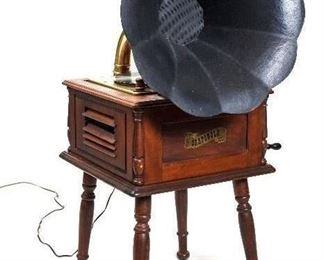 The Grafonola by Guild #785 Phonograph Replica with High Fidelity AM RadioAND Phonograph/Recorder Player. Plays all vinyl records including 45’s, 78’s, and 331/3 Albums.  Radio is tuned crank handle