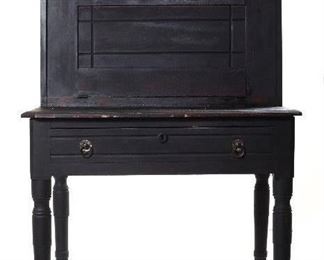 Antique 19th Century Black Paint Plantation Desk. A Fall front desk with a bottom which as serves a support for the fall front, thus eliminating the need for retractable supports.  There are interior small drawers and pigeonholes. 
(33”W x 23”D x 56”H)