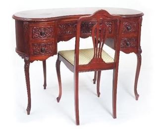 Vintage Kidney Shaped Writing Desk with Carved Front Door Panels and Matching Chair. (44”W x 19”D x 30”H)