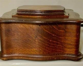 Closed View:  AMERICAN REGINA DISC MUSIC BOX. Regina was the largest producer of table top models built.    Beautiful oak cabinet done with a serpentine style with  original finish on cabinet