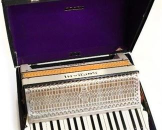 Italian Piano Accordion by Settimio Soprani, 120 bass buttons, 41 treble keys, coupling slide shown with a Hohner Case