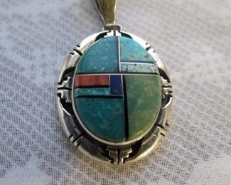 Signed P. Sanchez Zuni multi-stone inlay sterling silver pendant. $95