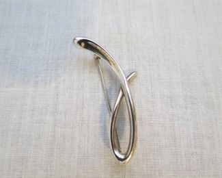 Tiffany & Co., Elsa Peretti sterling pin.