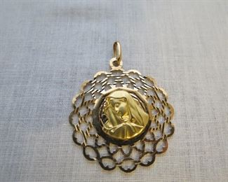 Large 18k gold Madonna pendant. 1-3/8 in diameter. $450.
