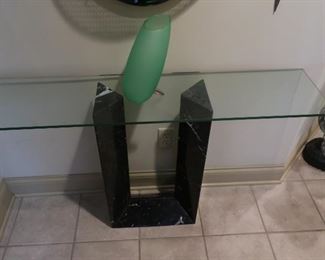 31    Black  marble stand with glass  top    48" x  11"    150.00