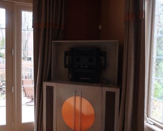 cabinet  that  holds  a  50"  television  and  it goes  up  and down           295.00