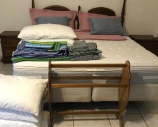 Bed linens. Quilt rack.