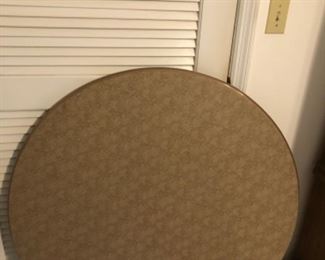 Round card table with padded vinyl top
