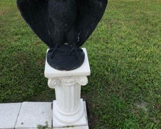 Concrete pedestal with concrete eagle statue