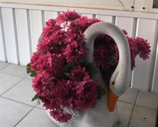 Concrete swan planter with flowers