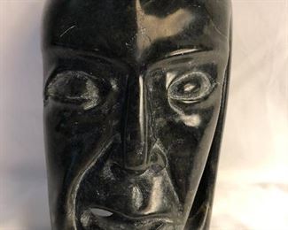 Inuit soapstone sculpture with papers. Artist: Toonoo Sharkey 1995.