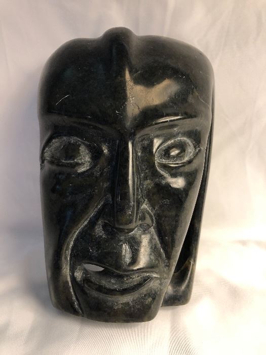 Inuit soapstone sculpture with papers. Artist: Toonoo Sharkey 1995.