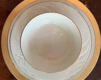 Dining Room:  This is just a sample of the  complete set of very neutral, classic LENOX china in the "Gold 'n' Sand Dune" pattern.  The set is dishwasher safe and includes 90 pieces:  12 dinner plates, 12 salad/dessert plates, 12 rimmed soup bowls, 12 small bowls, 12 bread & butter plates, 12 cups / 12 saucers, AND two oval platters, one oval serving bowl, one round serving bowl, one gravy with detached under-plate, and one covered casserole.   Their quilted china storage keepers are included.  The eight gold chargers are separately priced.